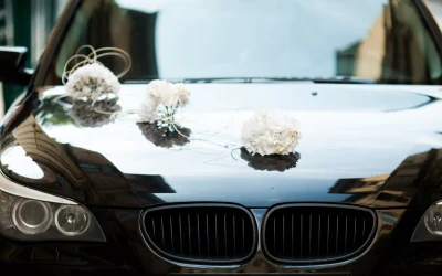 black-bmw-decorated-with-white-wedding-bouquets-scaled-6491e521b803e